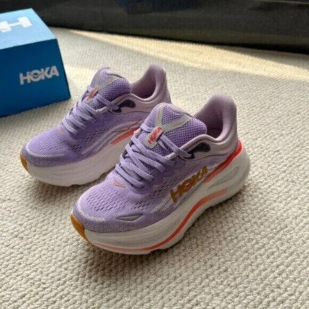 Hoka Purple and White athletic shoes